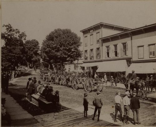 A march of horses pulling cannons.