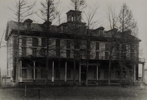 Huge four story building with balcony deck.