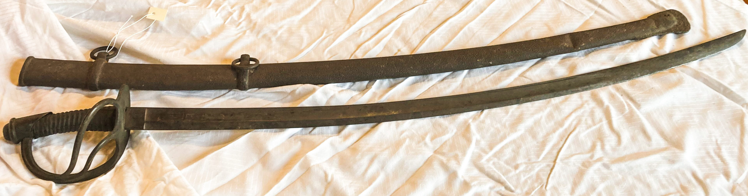 Curved Sword next to its scabbard.