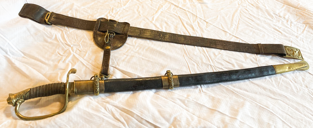 Sword in a scabbard with a belt attached