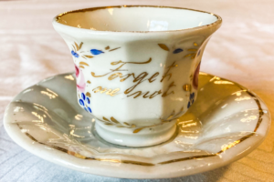 Tea cup with forget me not motif and flower pattern.