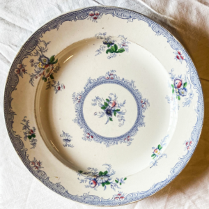 White plate with several small flower patterns.