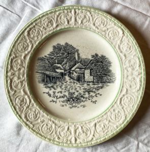 Plate with engraving of house and barn.