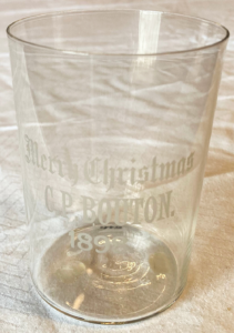 Glass cup with words "Merry Christmas, C.P. Bouton 1898."