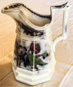 Pitcher with flower pattern.