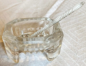 Glass sugar cup with pick.