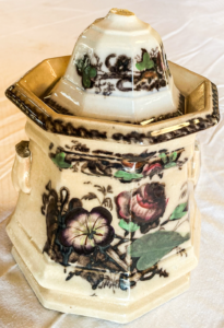 White tureen with flower pattern.