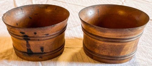 Two small wooden cups.