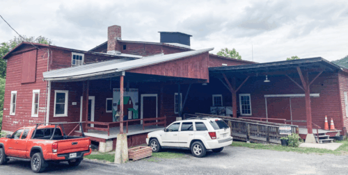 Bunn mill with two vehicles parked