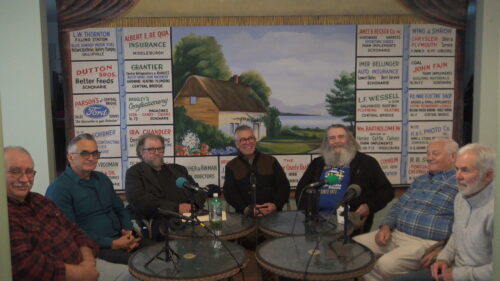 seven men at a table