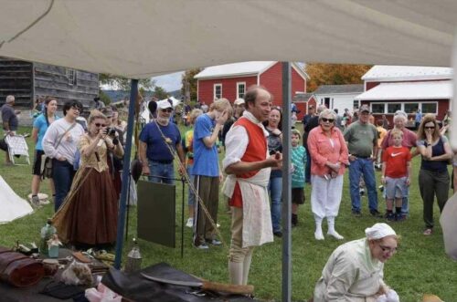 Paul speaking outside to a crowd.