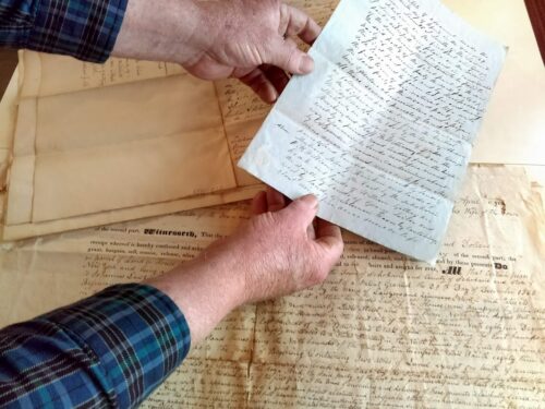 Person holding a document.