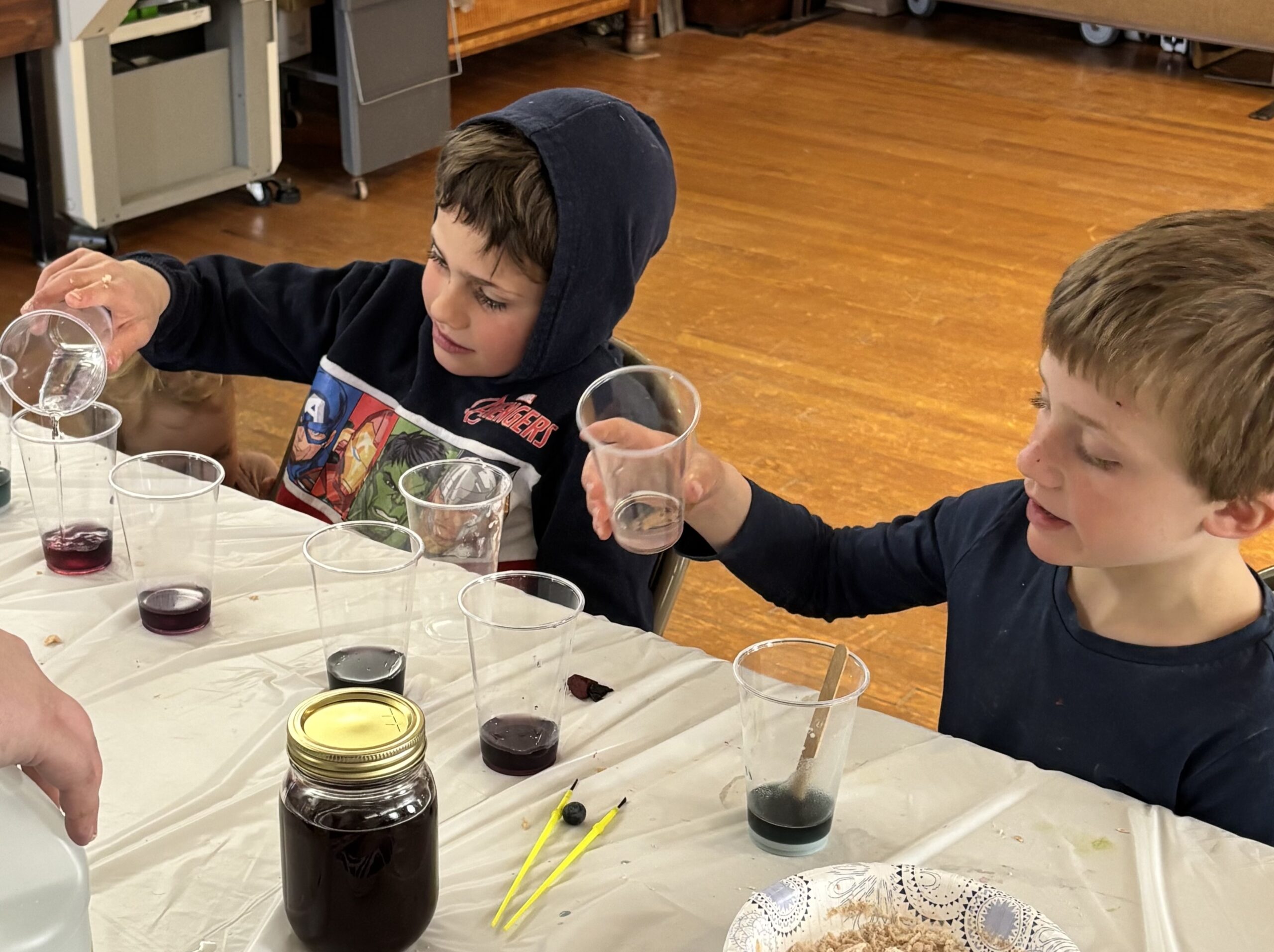 Two kids working on a science experiment.