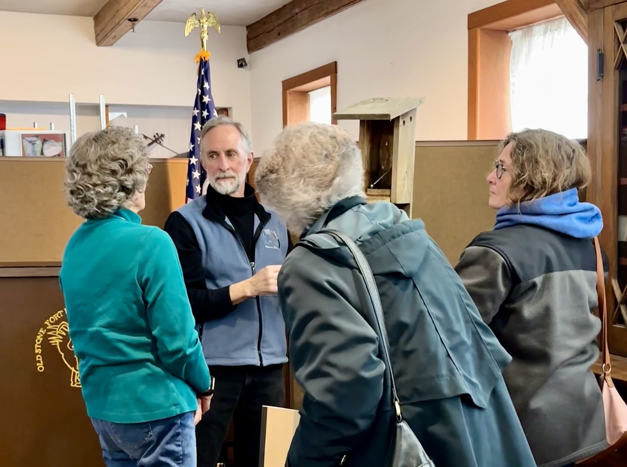 Kevin Berner showing off how the bird box works after his presentation.