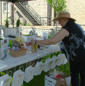 Volunteer setting up a raffle table.
