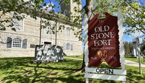 Open sign in front of the Old Stone Fort.