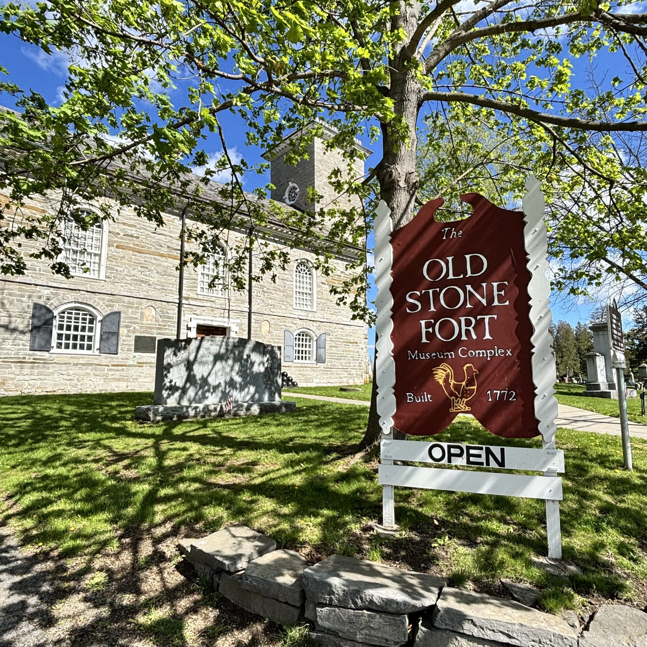 Open sign in front of the Old Stone Fort.