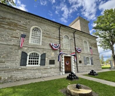 The Old Stone Fort decorated in red white and blue bunting for America's Semiquincentennial